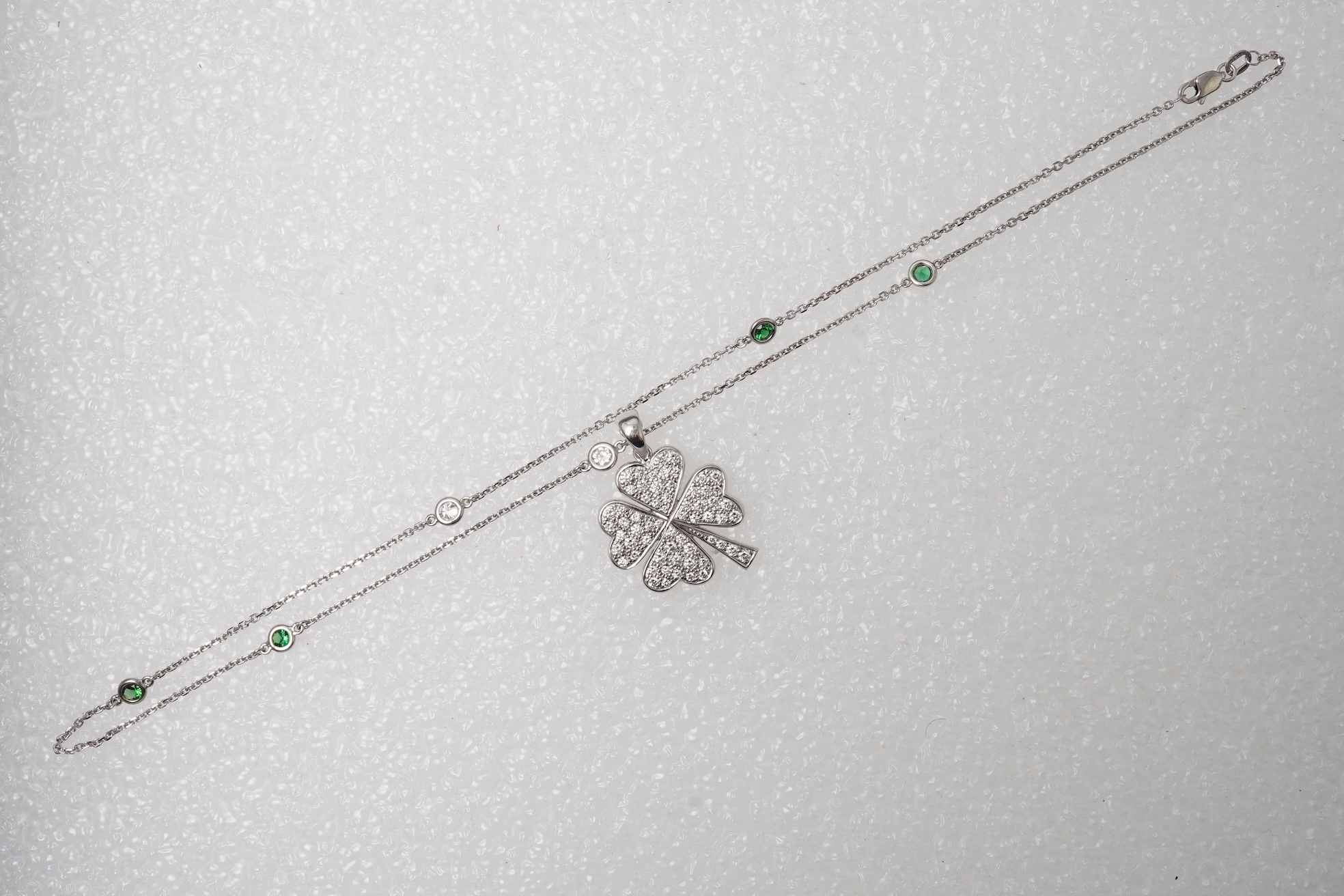 A diamond and tsavorite pendant necklace